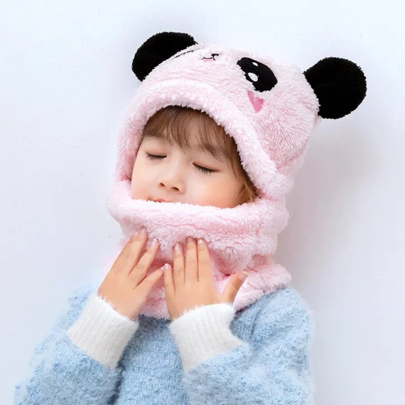 Child wearing a pink panda hat and scarf 