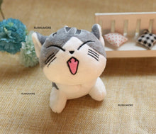 Cute cat stuffed doll with playful open-mouth face, a 9cm plush keyring for children to carry on bags and lunch boxes.