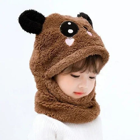 Child wearing a brown bear-themed hood