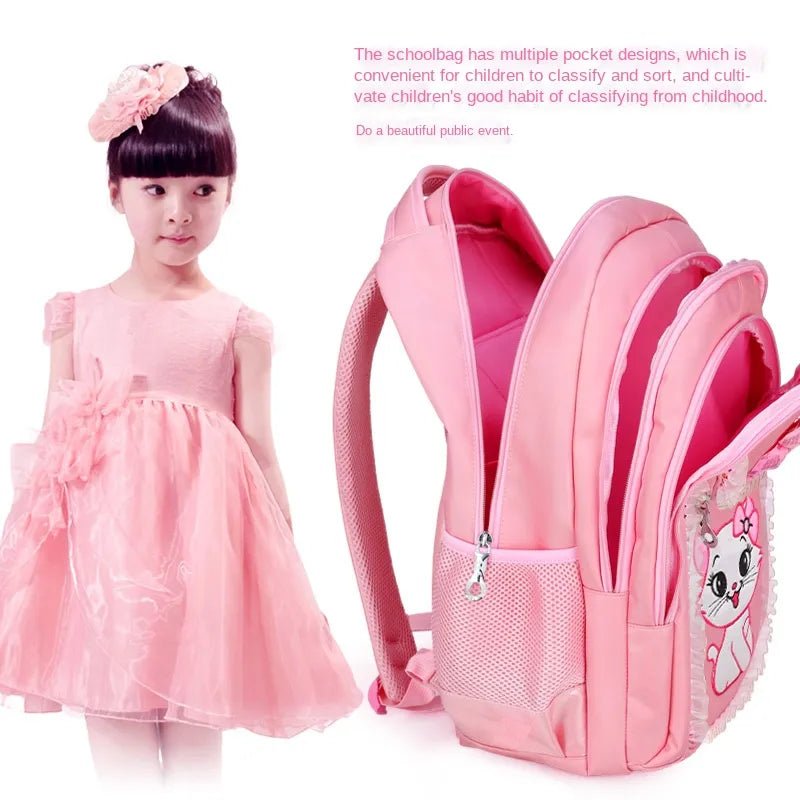 Pink dress and pink backpack with cartoon cat design.