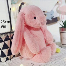 Cute pink long-eared bunny plushie with size guide for childrens gifting and bedtime comfort.