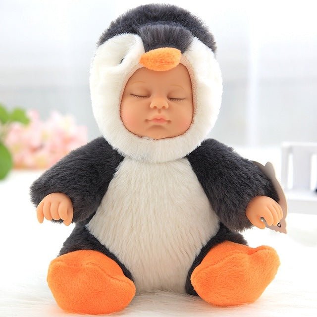 Baby doll dressed in a penguin costume.