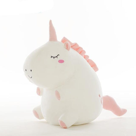 Plush toy unicorn with pink horn and ears.
