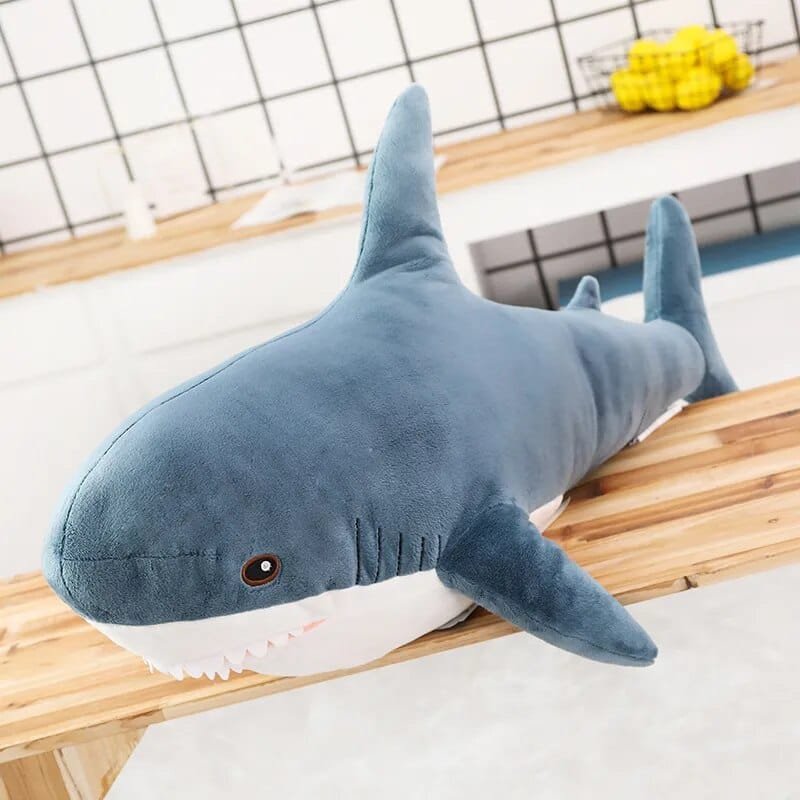 Plush shark toy of blue color.