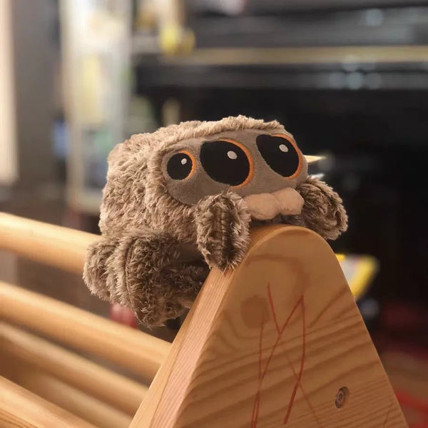 Cute Spider Plush Toy cartoon animal doll displayed on a wooden surface for kids gifting and play.