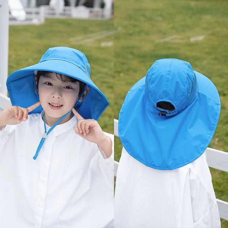 Child wearing a blue sun hat with a white background