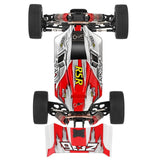 Top view of a red and white RC car chassis with visible branding on a white background