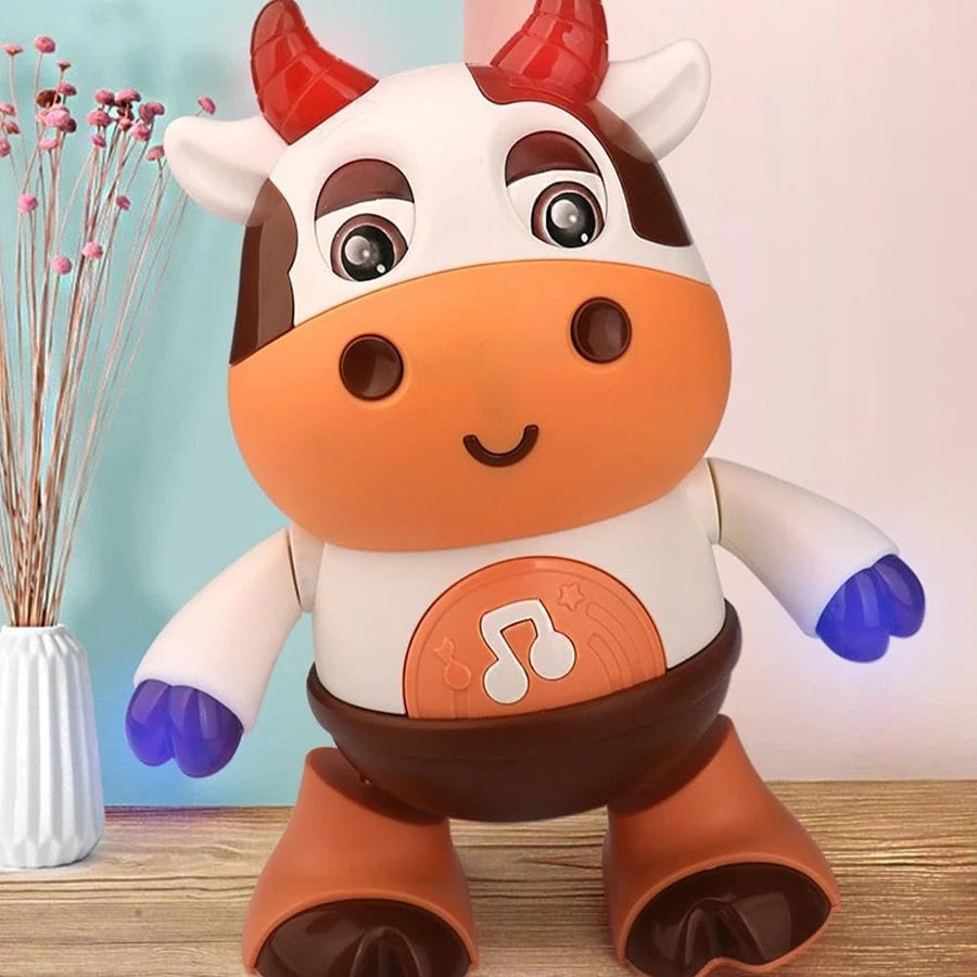 Close-up of the dancing cow toy with red horns and blue glowing hands