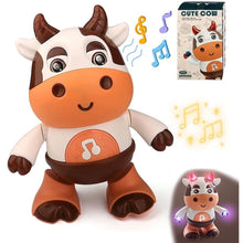 Dancing cow toy with music notes, its box and a lit-up view in the corner