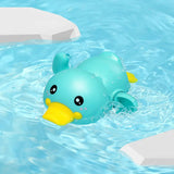 Toy duck floating in a pool with clear blue water