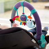 Colorful baby car seat toy with hanging characters in a stroller.
