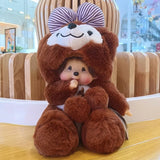 Stuffed toy bear with a striped bow sitting on a wooden table.
