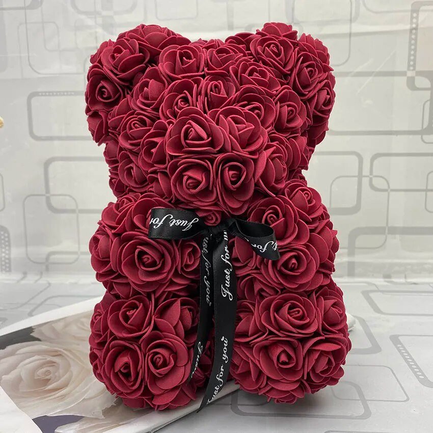Red rose teddy bear with a black ribbon