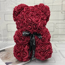 Red rose teddy bear with a black ribbon