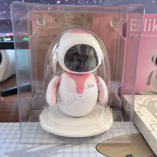 Pink and white desktop robot pet inside a clear plastic display package