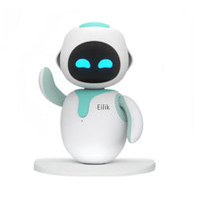 Sky blue and white desktop robot pet with glowing blue eyes and one arm raised on a round base