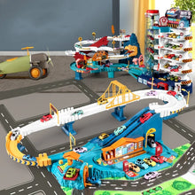 Dino multi-track parking lot road layout view showing the garage and included toy cars.