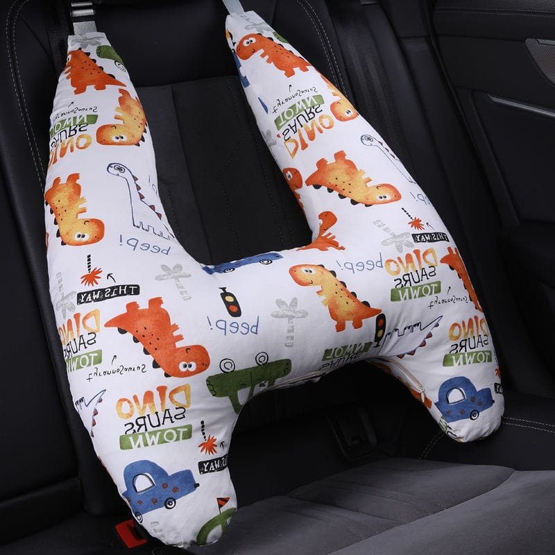 U-Shape Kids Travel Pillow with dinosaur harness pad for softer strap comfort and supported napping in the car.