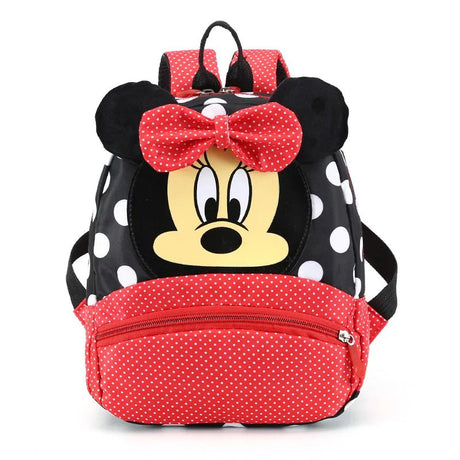 Backpack with Minnie Mouse design featuring a red bow and black polka dot pattern.