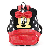 Backpack with Minnie Mouse design featuring a red bow and black and white polka dot pattern.