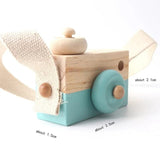Wooden toy truck with a turquoise base and beige accents.