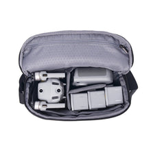 Gray bag with electronic devices inside.