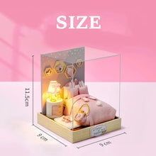 Miniature dollhouse accessory set with pink plush toy and lamp for cozy handcrafted room decor.