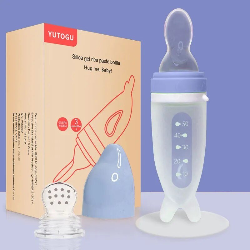 Dolphin Silicone Baby Feeding Bottle with Rice Cereal Spoon blue packaging set for on-the-go feeding.