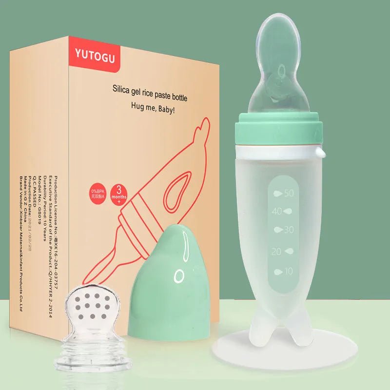 Dolphin Silicone Baby Feeding Bottle with Rice Cereal Spoon green packaging set for baby mealtime.