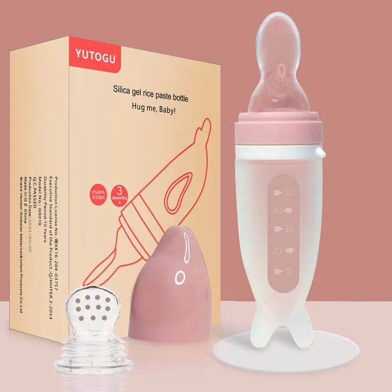 Dolphin Silicone Baby Feeding Bottle with Rice Cereal Spoon pink set shown for newborn gifting and daily feeding.