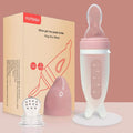 Dolphin Silicone Baby Feeding Bottle with Rice Cereal Spoon pink packaging set for infant self-feeding and mealtime training.