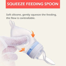 Dolphin silicone squeeze feeding spoon for baby rice cereal and soft food feeding at mealtime.