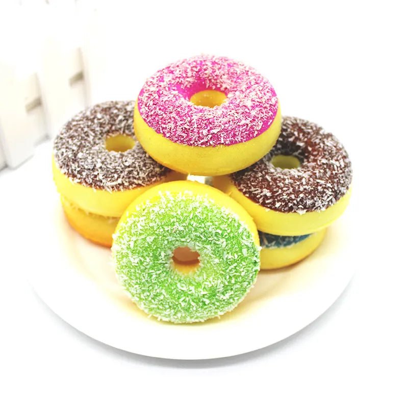 Donut squishy toys in bright colours for pretend play, sensory fidgeting, and party bag fillers.