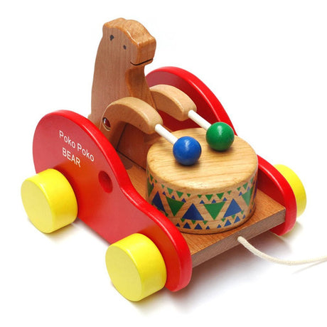 Wooden toy with a bear design.