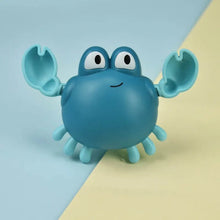 Duck and Penguin Egg Water Spray Bath Toy blue crab shape shown for another bathtub play view.