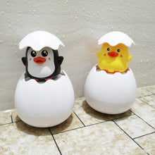 Duck and Penguin Egg Water Spray Bath Toy penguin and duck pair displayed on tile for bathroom play.