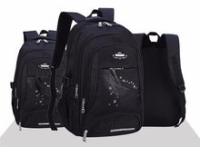 Three black backpacks with a visible brand logo
