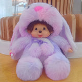 Stuffed toy with a purple bunny costume on a wooden floor.