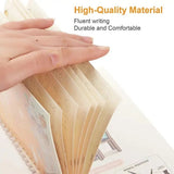 Hand holding a spiral-bound notebook with text about high-quality material, fluent writing, durability, and comfort.