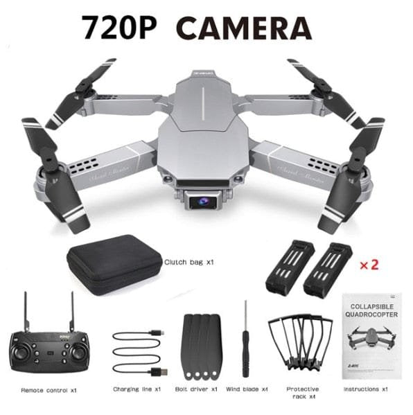 E68 foldable drone with remote and spare parts in a flat lay for easy setup before outdoor flying sessions.