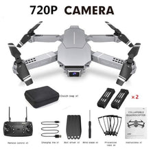 E68 foldable drone with remote and spare parts in a flat lay for easy setup before outdoor flying sessions.