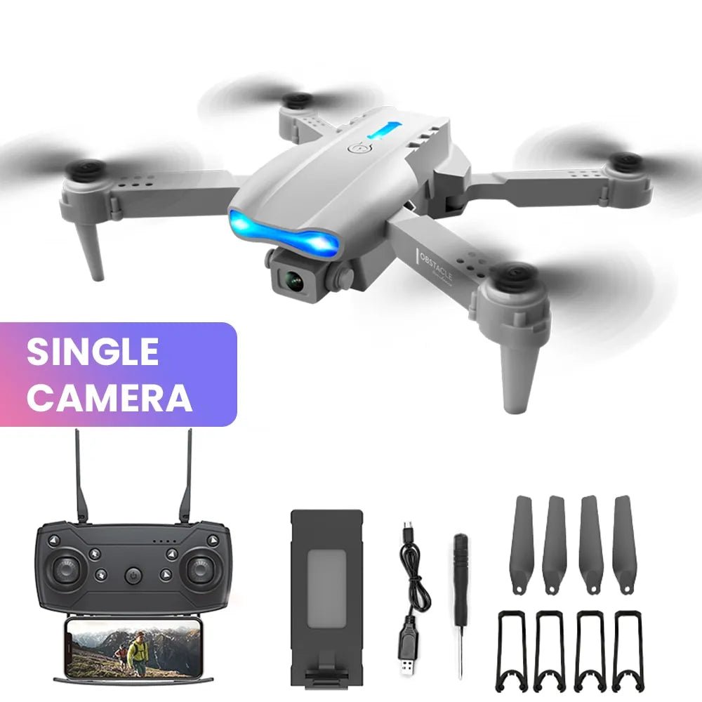 E99 K3 Pro drone accessories flat lay with landing gear and propellers for quadcopter assembly.