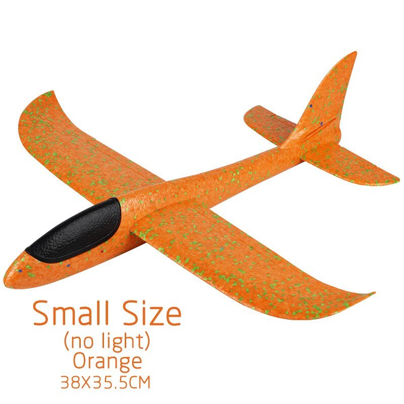 Orange toy airplane with green speckles.