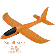 Orange toy airplane with green speckles.