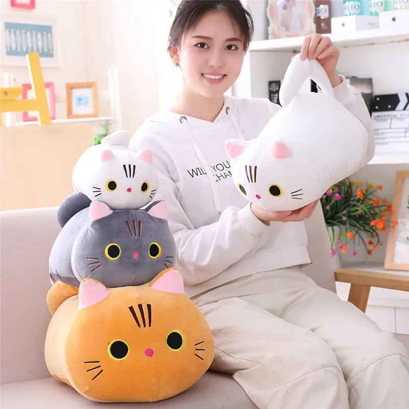 Woman holding a stack of cat-shaped cushions in a cozy living room.