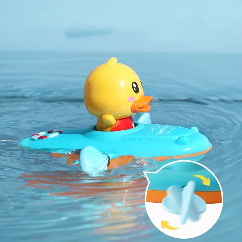 Yellow rubber duck in a blue boat on water with a close-up of the boat's propeller.