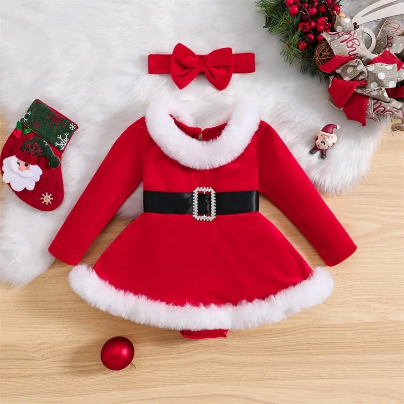 Red Santa Claus dress with white fur trim, black belt, and matching headband on a wooden surface.