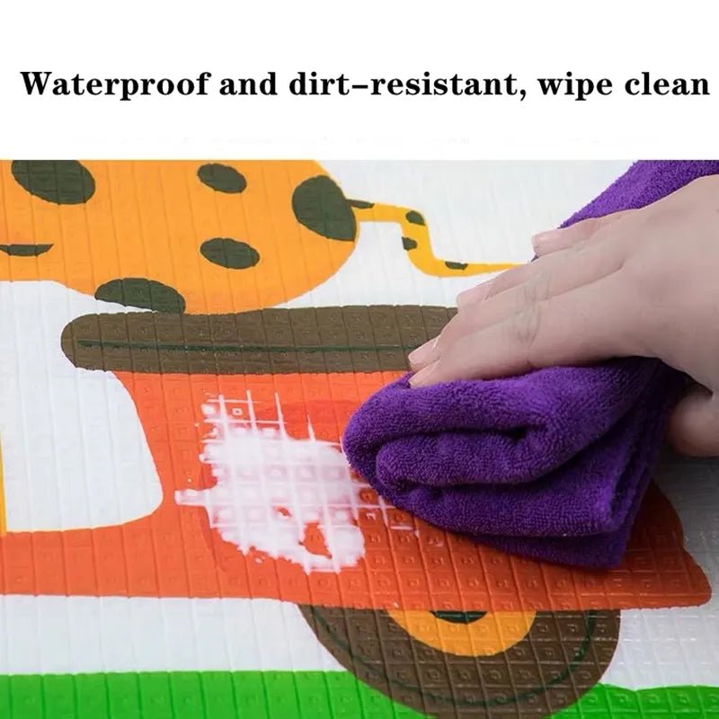 Eco-Friendly EPE baby crawling mat being wiped clean, showing its waterproof and dirt-resistant surface for easy maintenance.
