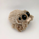 Plush toy sloth on a light gray background