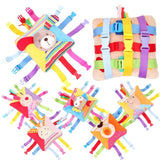 Colorful baby toys with various shapes and patterns on a white background